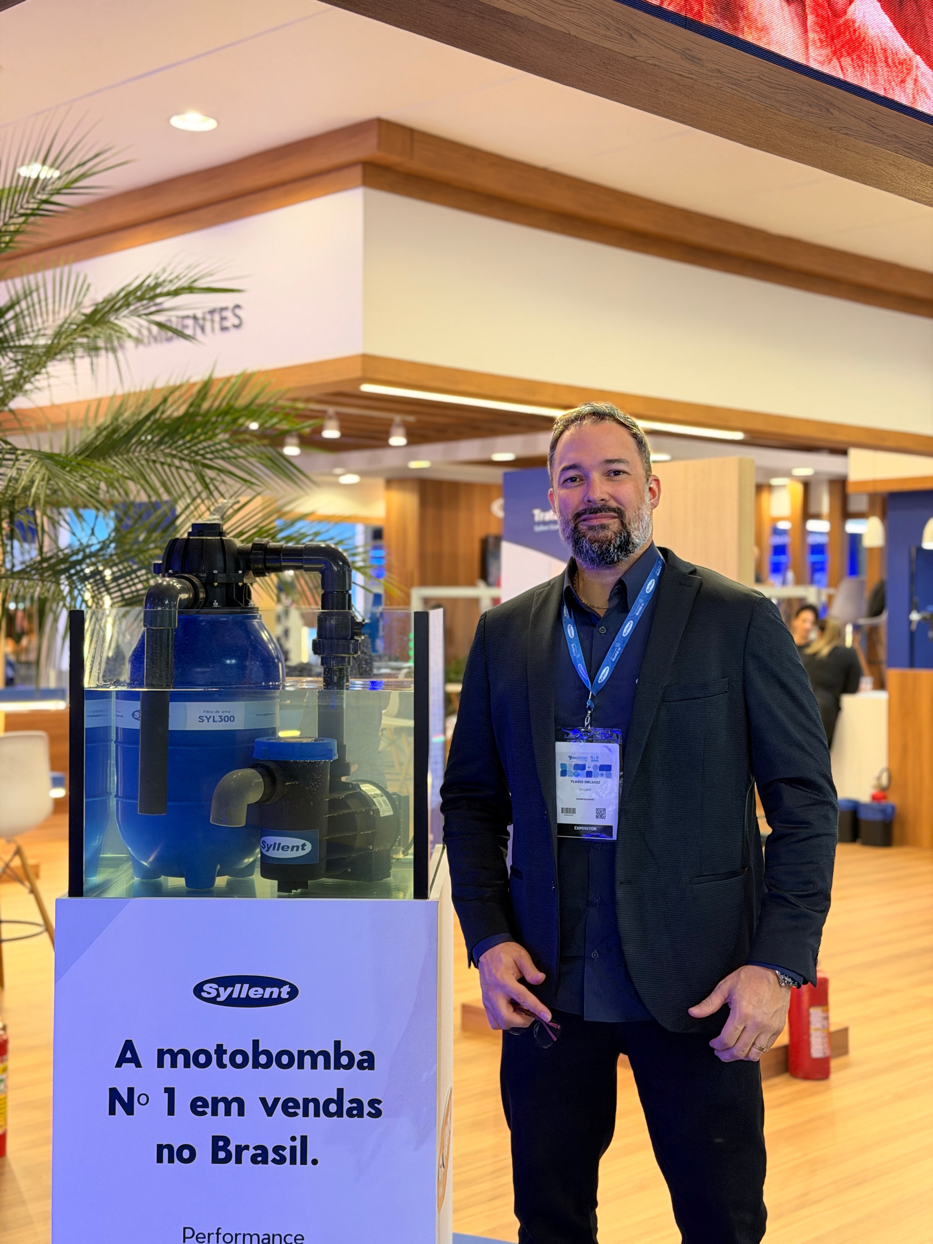 Flávio Orlandi em evento profissional da Syllent